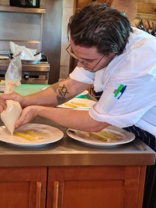 Chef Lucas Istace plating meals